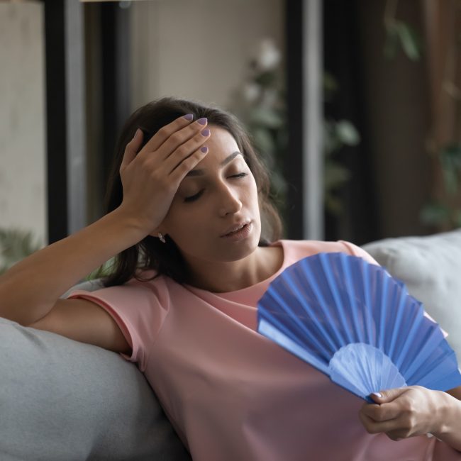 Too,Hot.,Exhausted,Female,Suffer,From,Heat,In,Modern