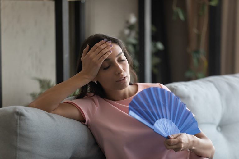 Too,Hot.,Exhausted,Female,Suffer,From,Heat,In,Modern