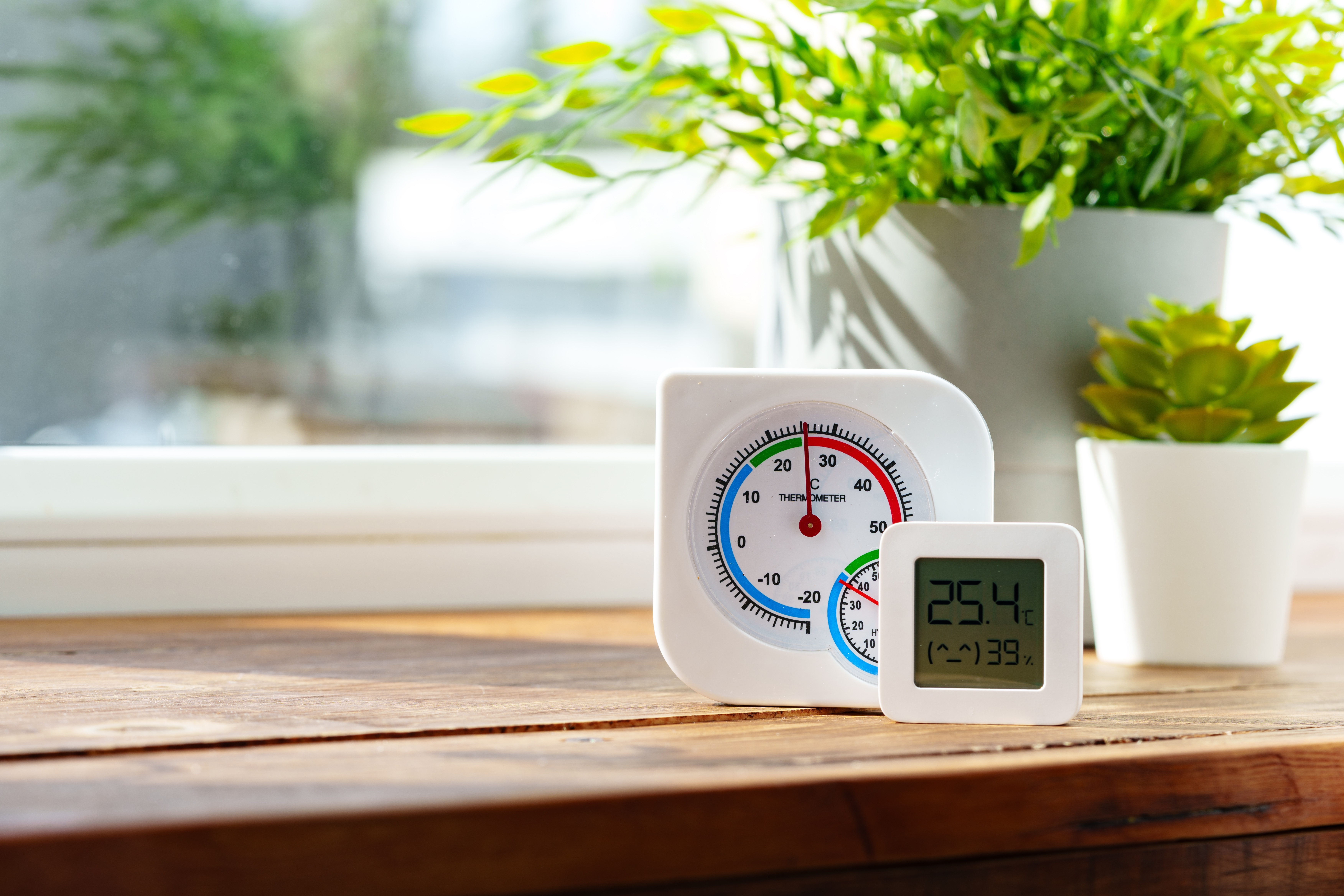 Digital,Thermometer,Displaying,Temperature,And,Humidity,Near,Window