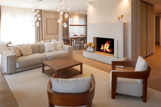 Prestigious,Living,Room,,Inside,Sofa,Armchairs,And,A,Beautiful,Burning