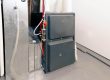 A residential heater in a basement.